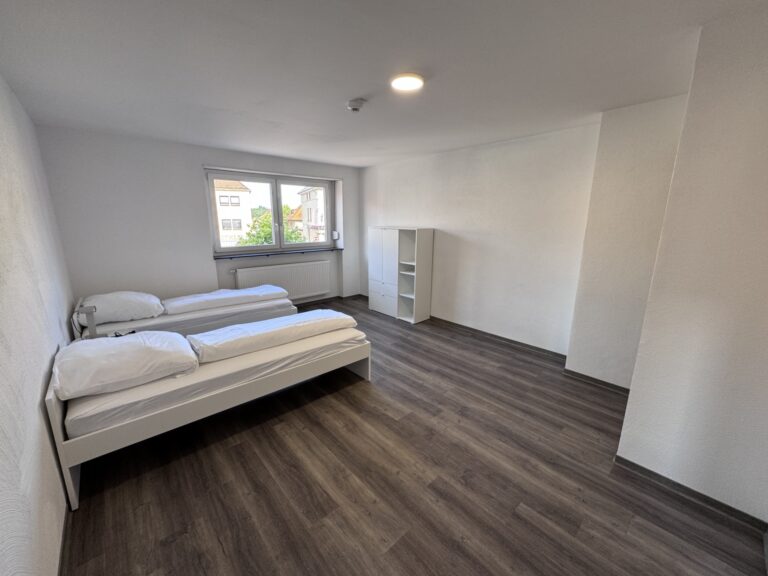 Schlafbereich mit Einzelbetten in Apartment 5 im Haus Burgkeller