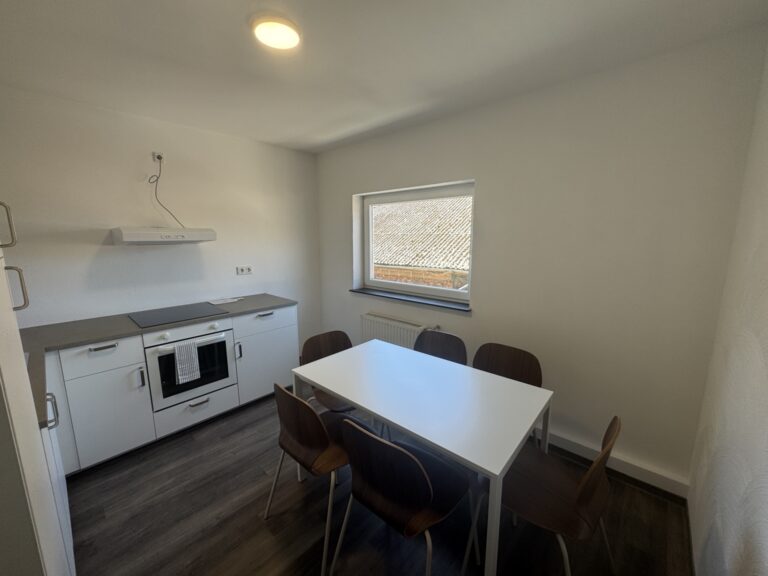 Schlafzimmer mit Einzelbetten in der 6-Personen-Wohnung 3 im Haus Burgkeller